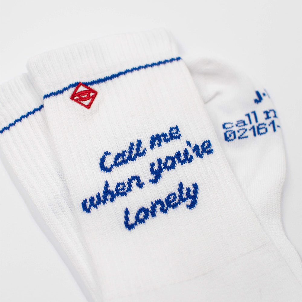 J.Clay Socken Call Me zusammengelegt im Detail, mit Telefonnummer als humorvolles Detail auf der Sohle