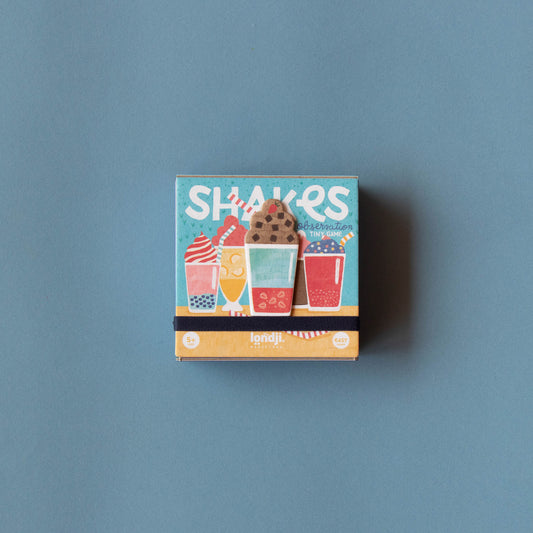 Frontansicht des Mini-Spiels „Shakes“ von Londji mit Illustration eines farbenfrohen Shakes
