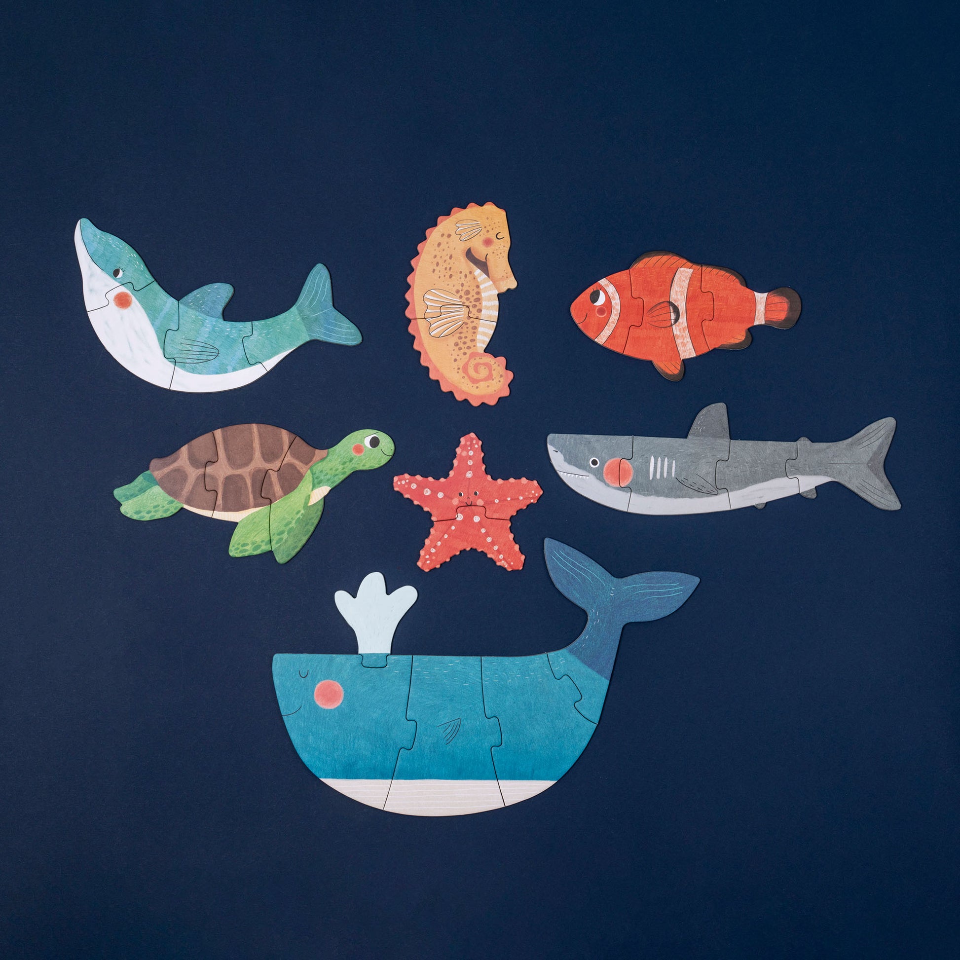 Kinderpuzzle von Londji zeigt zusammengesetzte Meeresbewohner: Wal, Hai, Delfin, Schildkröte, Seestern, Clownfisch und Seepferdchen