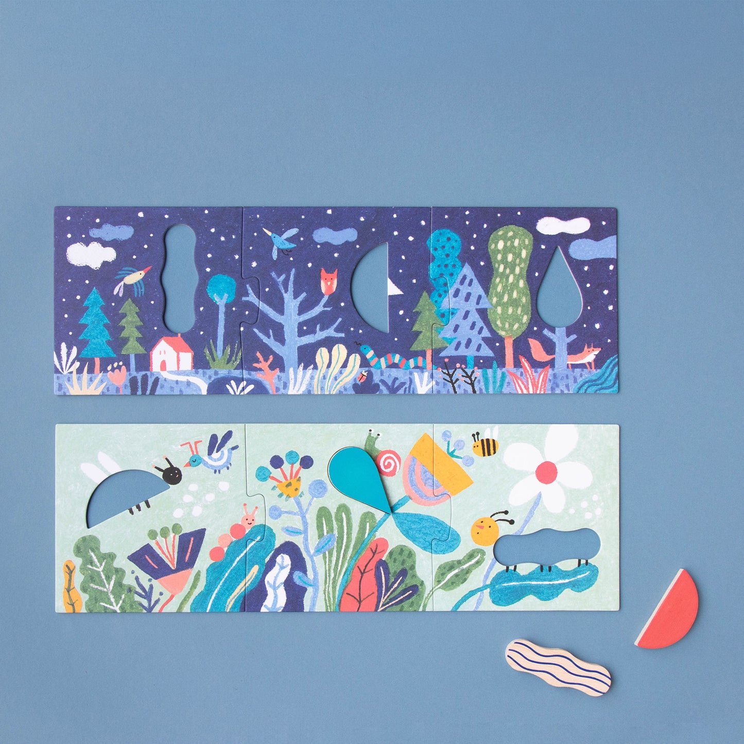 Puzzle „Imagine“ von Londji, drei zusammengelegte Teile bilden einmal einen nächtlichen Wald mit Sternenhimmel, ein anderes Mal eine bunte Blumenwiese